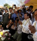 Rainsy, president of the Cambodia National Rescue Party, prays during a ceremony in Phnom Penh