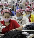 Employees work at the W & D Cambodia Co. Limited garment factory in Phnom Penh