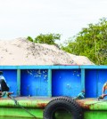workers_maintain_a_barge_carrying_sand_dredged_from_the_tatai_river_earlier_this_year_in_koh_kong_province_25_06_2016_athena_zelandonii
