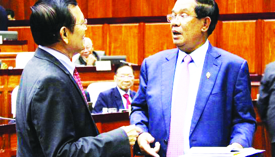1_prime_minister_hun_sen_right_and_deputy_opposition_leader_kem_sokha_meet_at_the_national_assembly_yesterday_in_their_first_encounter_since_sokha_was_pardoned_for_alleged_prostitution_07_12_2016_afp