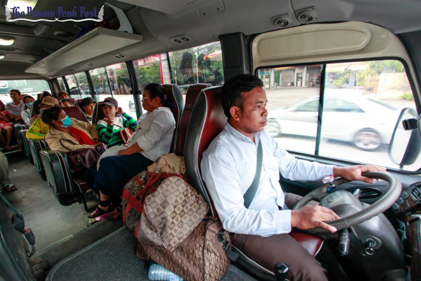 a_bus_driver_travels_down_monivong_in_a_city_bus_08_04_2016_pha_lina