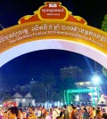 people_partake_in_festival_activities_under_a_sign_welcoming_visitors_to_the_5th_river_festival_2019_in_kampong_chhnang_town._ministry_of_tourism