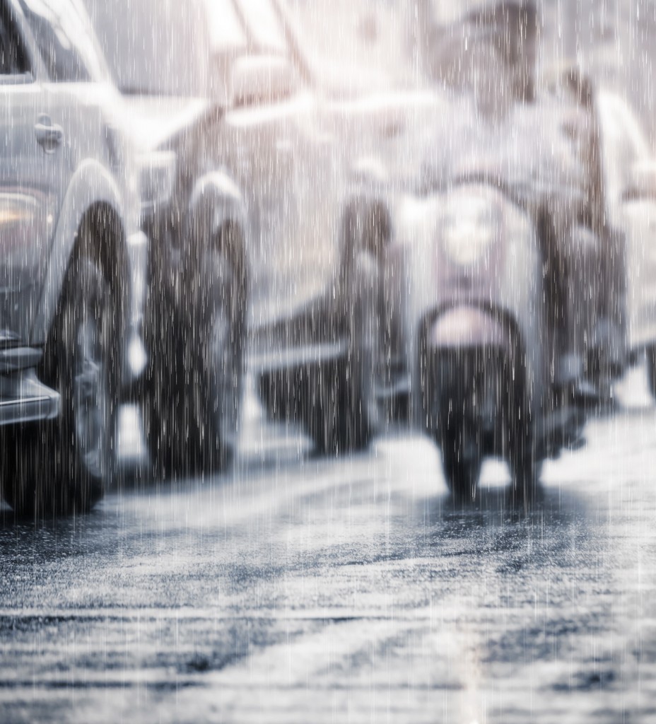 Hard rain fall in the city with blurry cars .Selective focus and