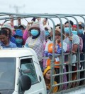 garment_factory_workers_commute_to_work_in_a_truck_on_national_road_3_in_phnom_penh_in_march._hong_menea_0