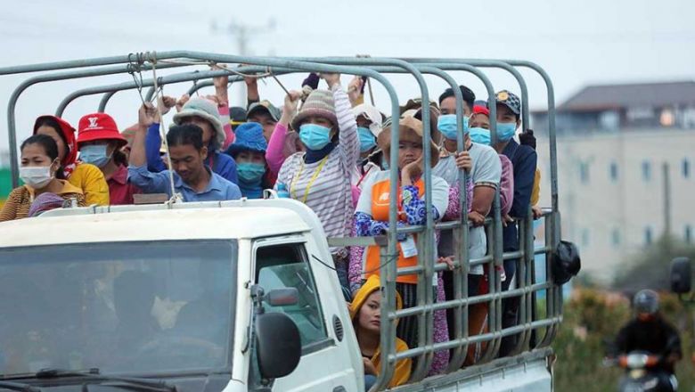 garment_factory_workers_commute_to_work_in_a_truck_on_national_road_3_in_phnom_penh_in_march._hong_menea_0