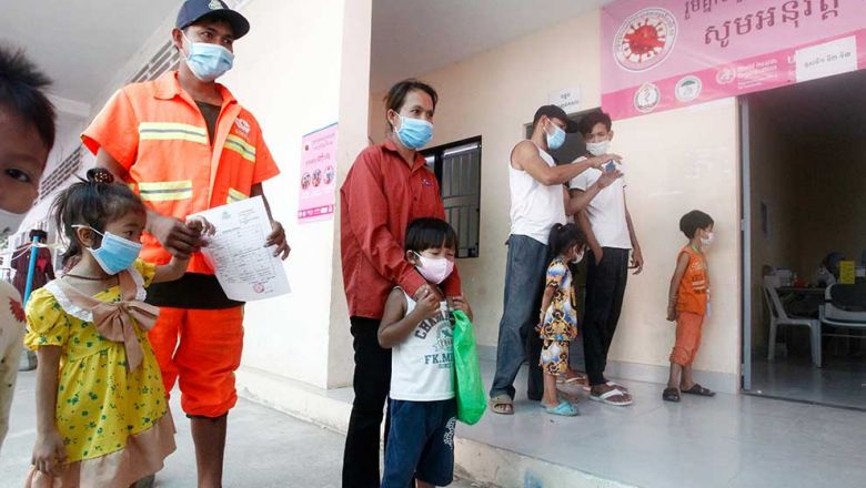people_bring_their_children_for_covid-19_vaccinations_at_the_chbar_ampov_referral_hospital_in_phnom_penh_on_march_2._heng_chivoan
