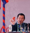 prime_minister_hun_sen_holds_a_can_of_coca-cola_at_the_2016_launch_of_the_coca-cola_factory_in_western_phnom_penh._supplied