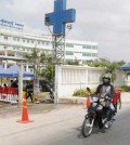 a_food_delivery_man_rides_past_the_nokor_tep_womens_hospital_now_known_as_luong_mer_hosptial_in_prey_sar_commune_of_phnom_penhs_dangkor_district_on_march_28_2021._heng_chivoan