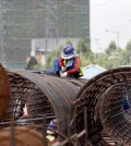 construction_workers_weld_iron_to_build_flyover_in_meanchey_district_in_may._heng_chivoan