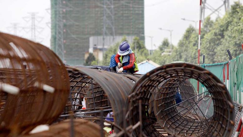 construction_workers_weld_iron_to_build_flyover_in_meanchey_district_in_may._heng_chivoan