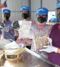 members_of_boeung_rumpe_fish_processing_women_handicraft_show_their_fish_product_during_the_visit_of_agriculture_minister_dith_tina_on_june_27._maff