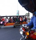 garment_workers_commuting_home_from_work_on_national_road_5._hong_menea