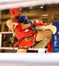 28_3_2024_kun_khmer_boxer_lao_chetra_in_red_launches_a_knee_strike_at_his_vietnamese_opponent_during_the_32nd_sea_games_in_cambodia_in_may_2023_hong_menea