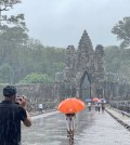 19_7_2024_visitors_take_photos_at_angkor_thom_s_south_gate_this_week_ana